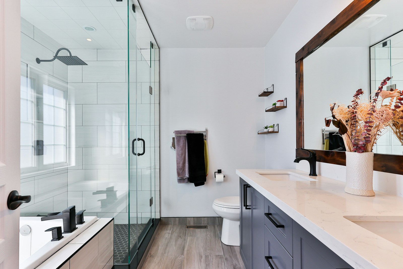 Hand-glazed emerald green and terracotta tiles forming a herringbone kitchen backsplash in natural morning light